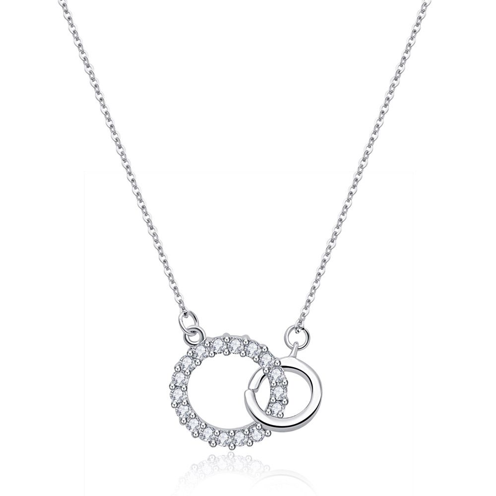 Overlap Circles Necklace featuring a rhodium-plated brass pendant with two interlinking circles, one adorned with sparkling white cubic zirconia.