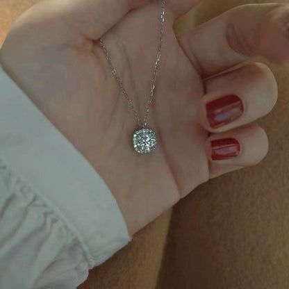 A close-up view of the 925 Sterling Silver Elegant Square Necklace, showcasing the sparkling cubic zirconia pendant.