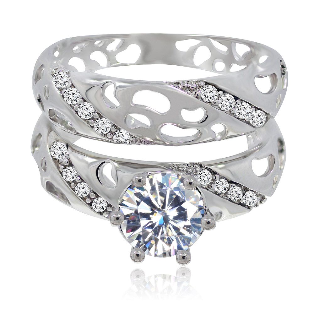 Timeless Ring Set featuring a rhodium-plated ring with a large central cubic zirconia stone surrounded by smaller stones on an intricately designed band.