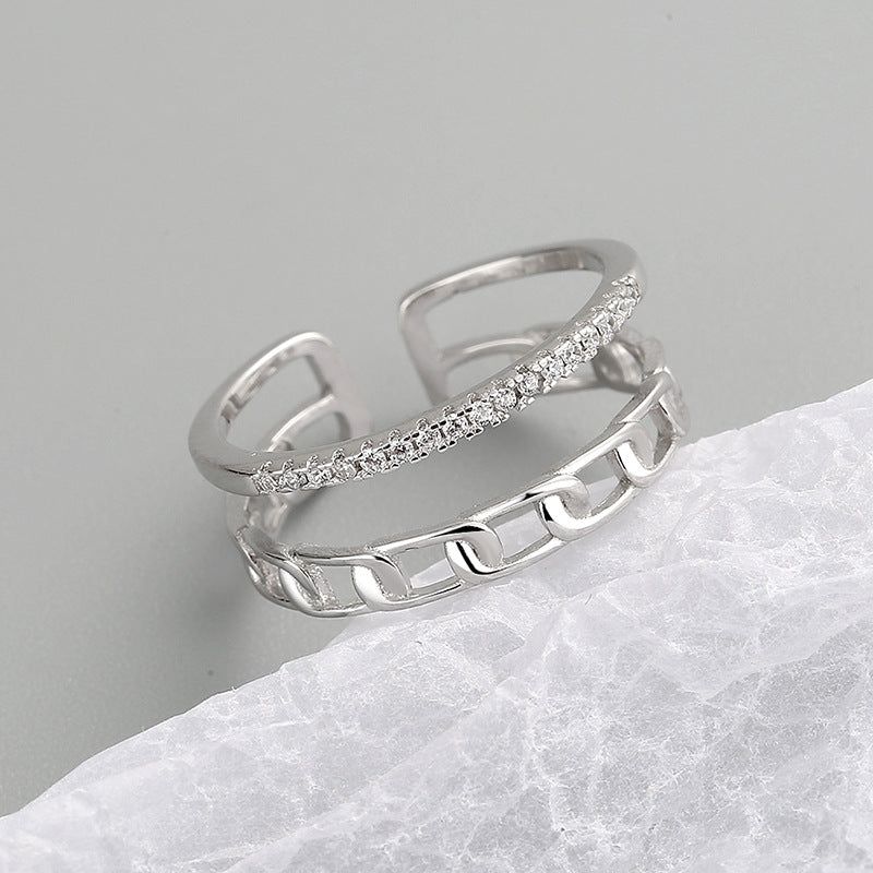 A stylish set of 925 sterling silver adjustable open rings, showcasing a modern two-layered chain-link design alongside a band with sparkling stones.