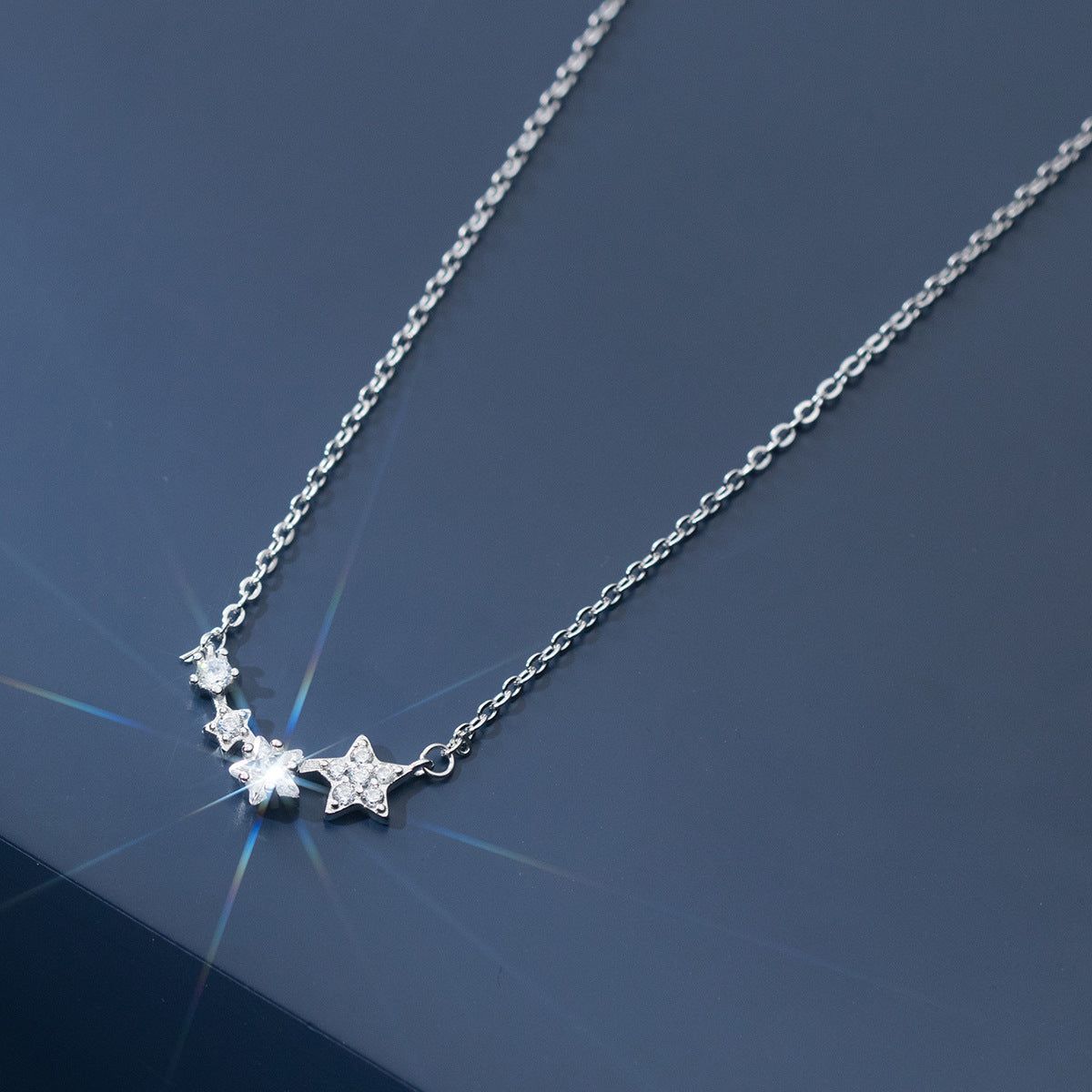 A close-up of the 925 Sterling Silver Dainty Zircon Star Pendant Necklace, showcasing its sparkling star-shaped design.
