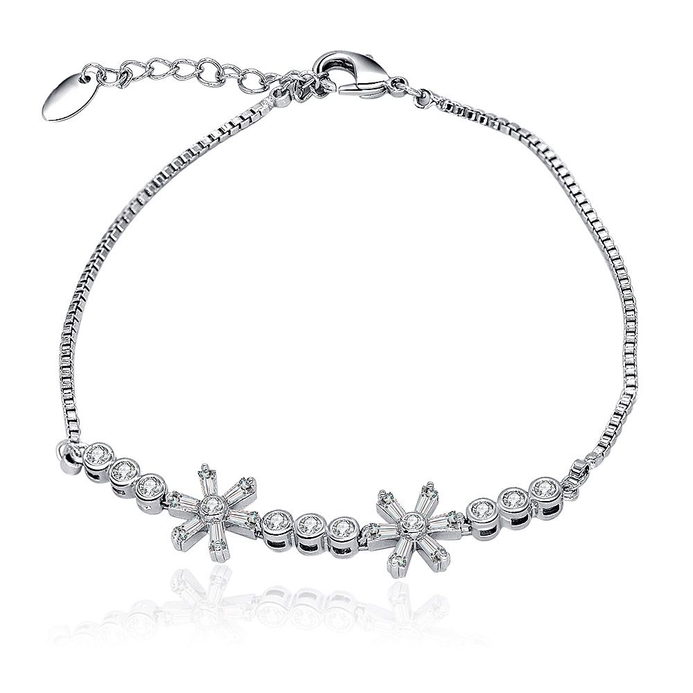 A stunning CZ Floral Flower Charms Box Chain Bracelet displayed on a white surface, highlighting its intricate flower motifs and sparkling cubic zirconia stones.