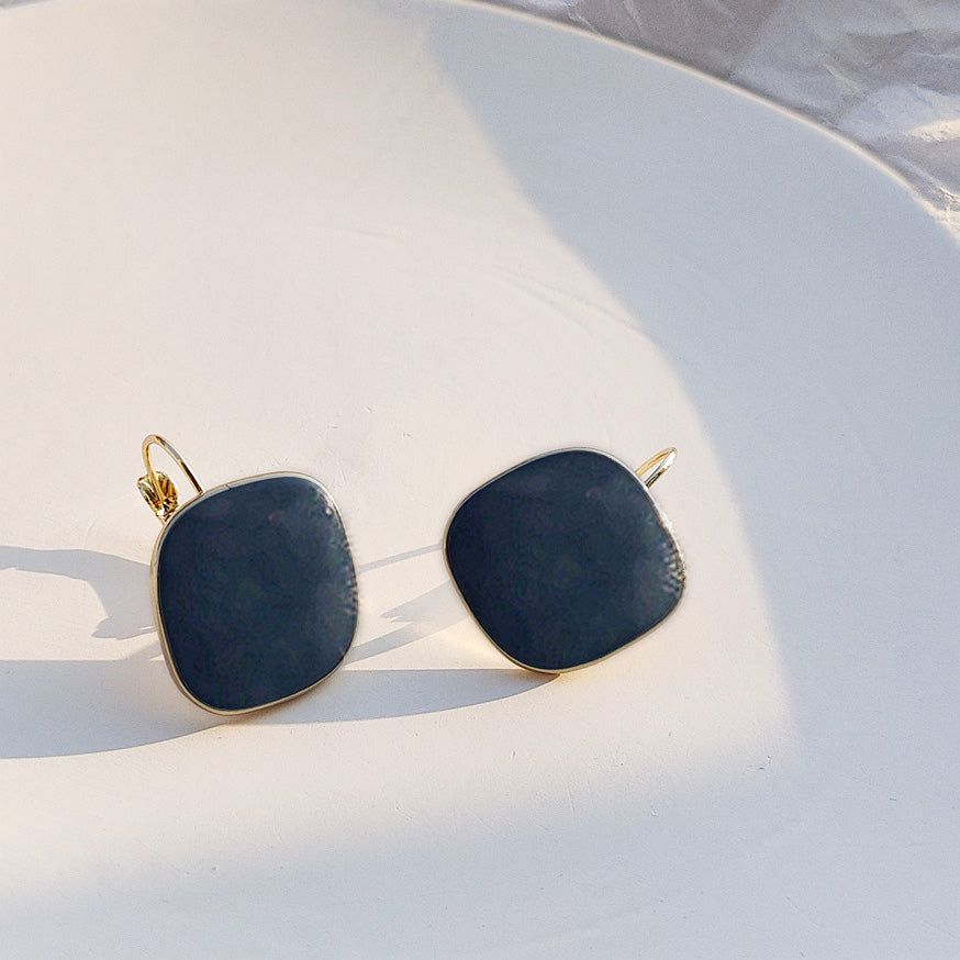 A pair of vintage navy blue enamel square hoop earrings with gold rims, offered by JR Fashion Accessories.