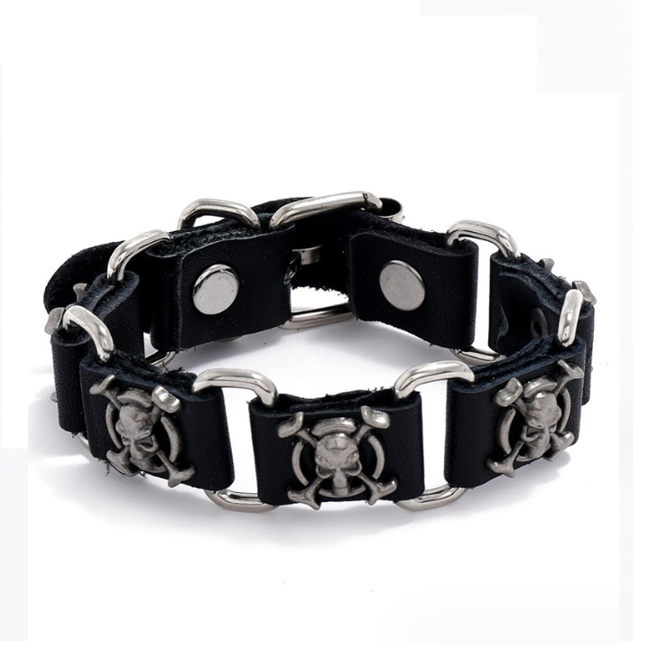 A close-up view of the Skull PU Leather Bracelet for Men, showcasing the detailed stainless steel skull accent on the black braided leather band.