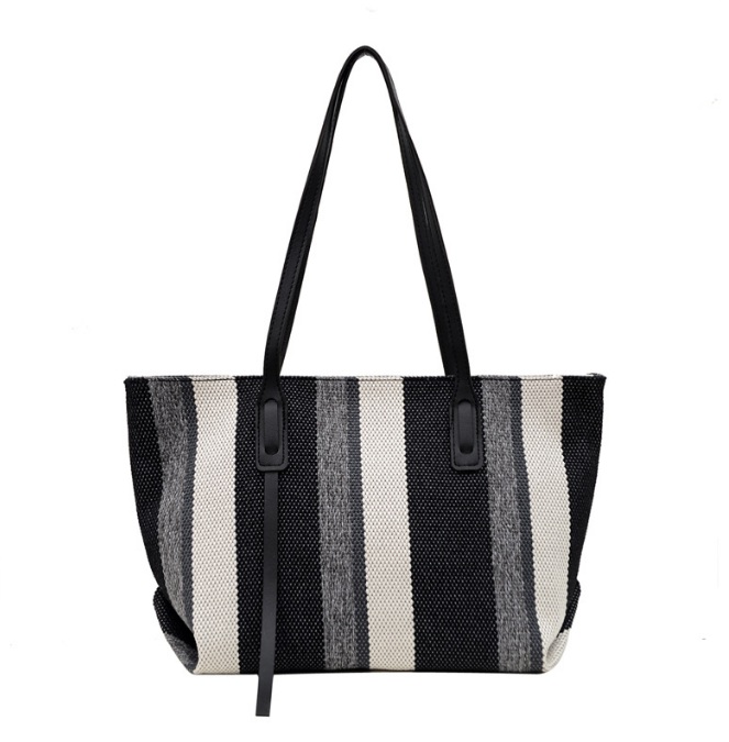 A stylish black, white, and gray striped canvas tote bag with PU leather details, offered by JR Fashion Accessories.