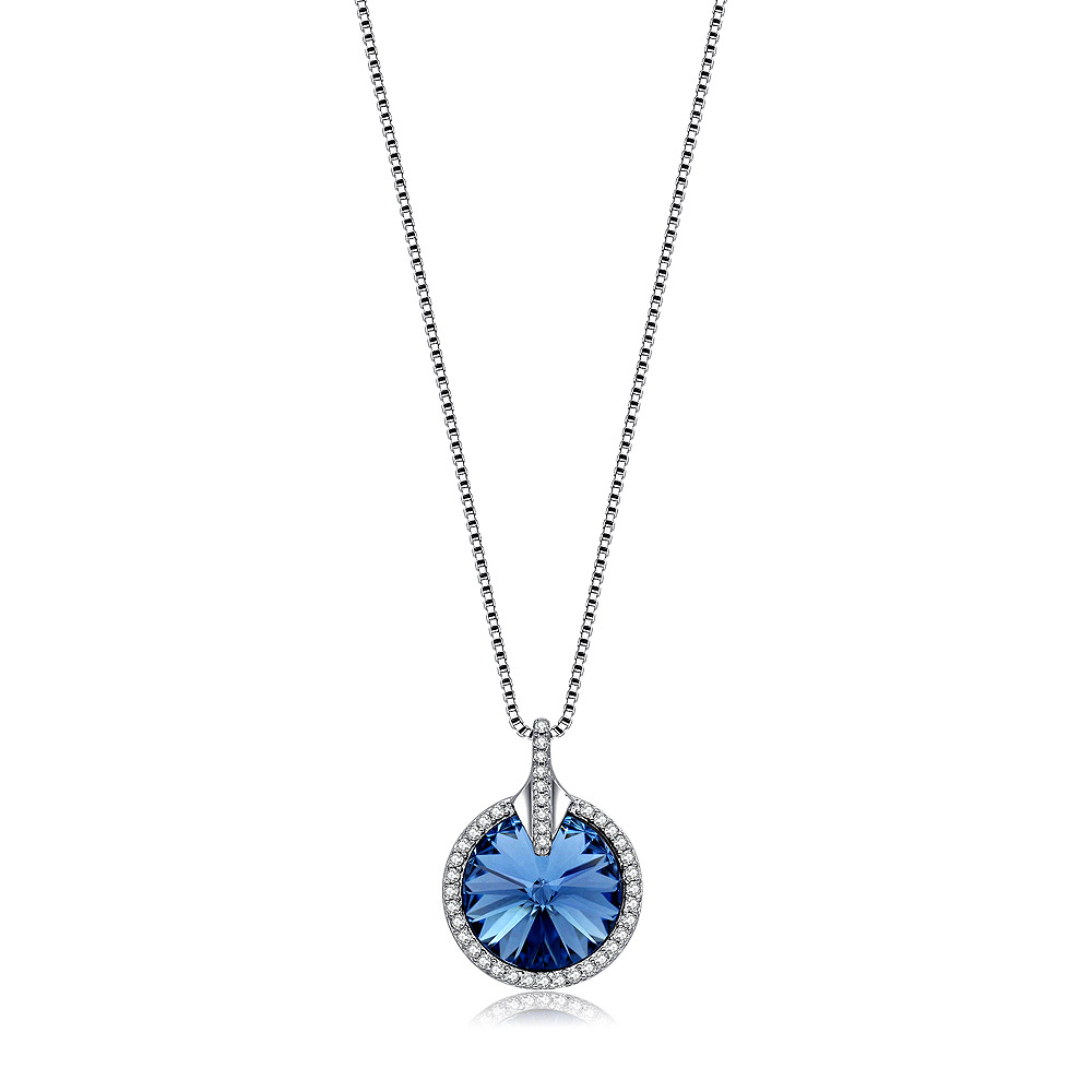 A close-up of the Crystal Round Glance Blue Necklace, showcasing the brilliant blue Swarovski crystal pendant encircled by smaller clear stones, on a 925 sterling silver chain.