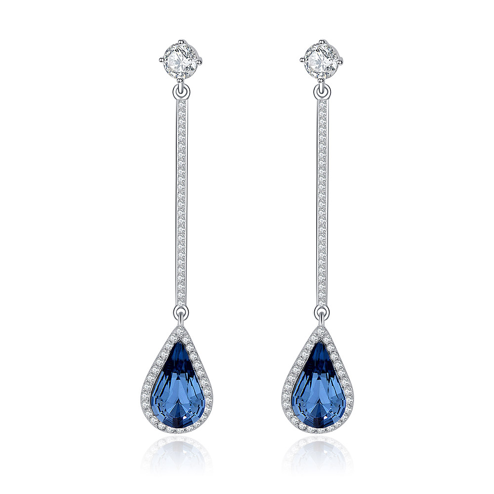A pair of luxurious chandelier earrings featuring teardrop-shaped blue sapphires surrounded by sparkling diamonds, set in silver. A prime example from JR Fashion Accessories' custom jewelry collection.