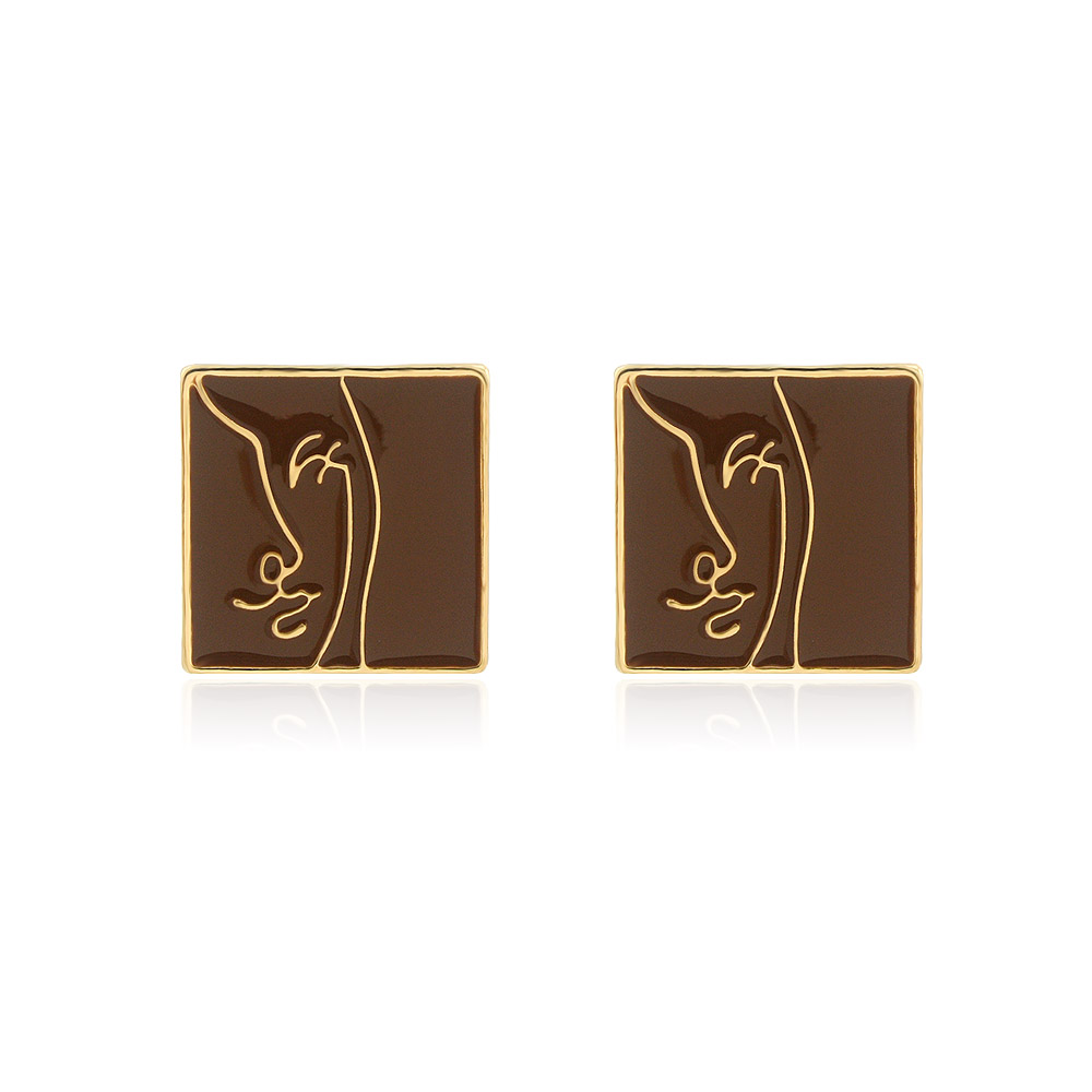 A pair of Enamel Brown Face Stud Earrings with a unique gold-plated profile design on a white background.