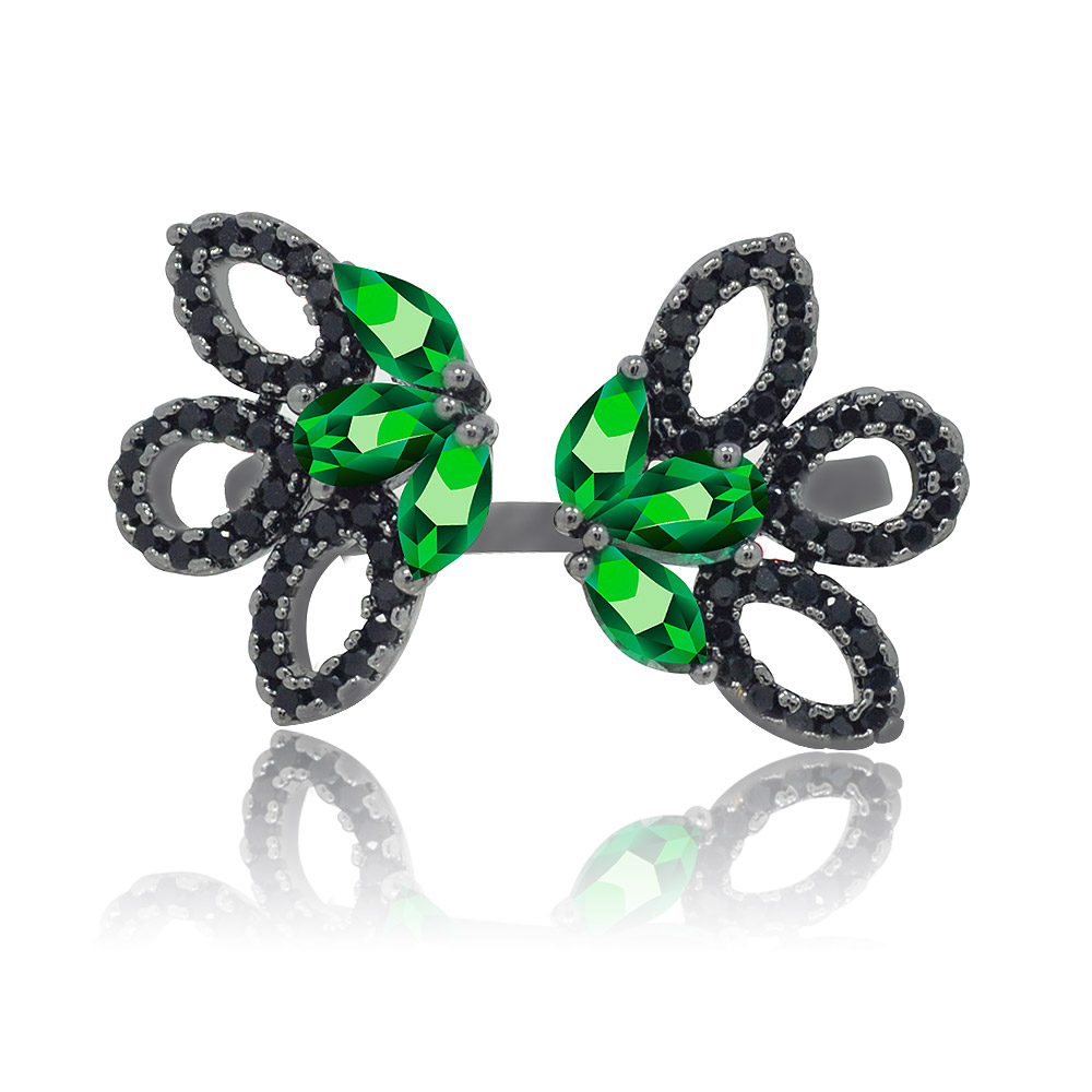 A detailed front view of the Emerald Hematite Filigree Cocktail Ring, showcasing its intricate butterfly design with vibrant green gemstones and sparkling cubic zirconia accents on a hematite-plated brass band.