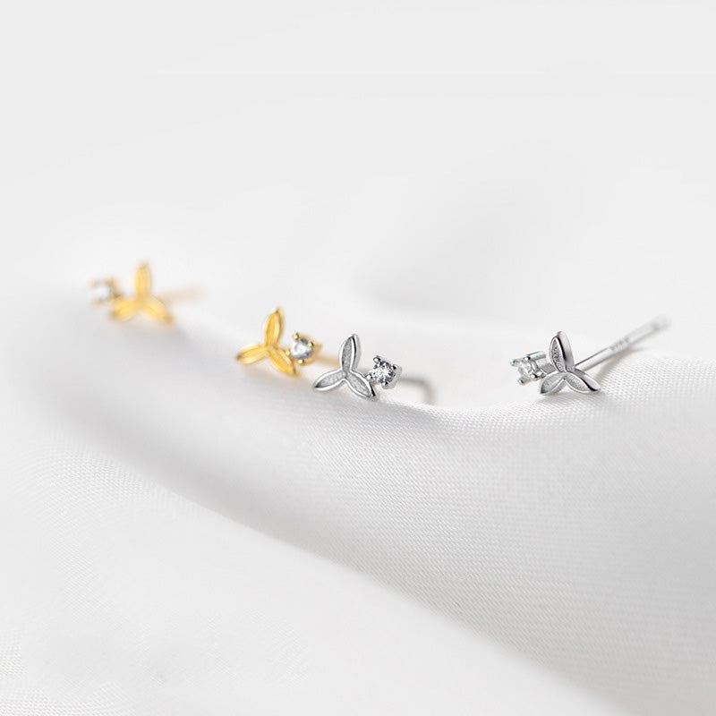 A set of 925 sterling silver tiny zircon flower stud earrings in silver and gold finishes, displayed on a neutral background.