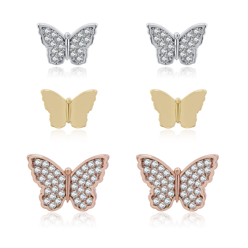 A set of three pairs of mini butterfly stud earrings in rhodium, gold, and rose gold plating, displayed on a clean white background.