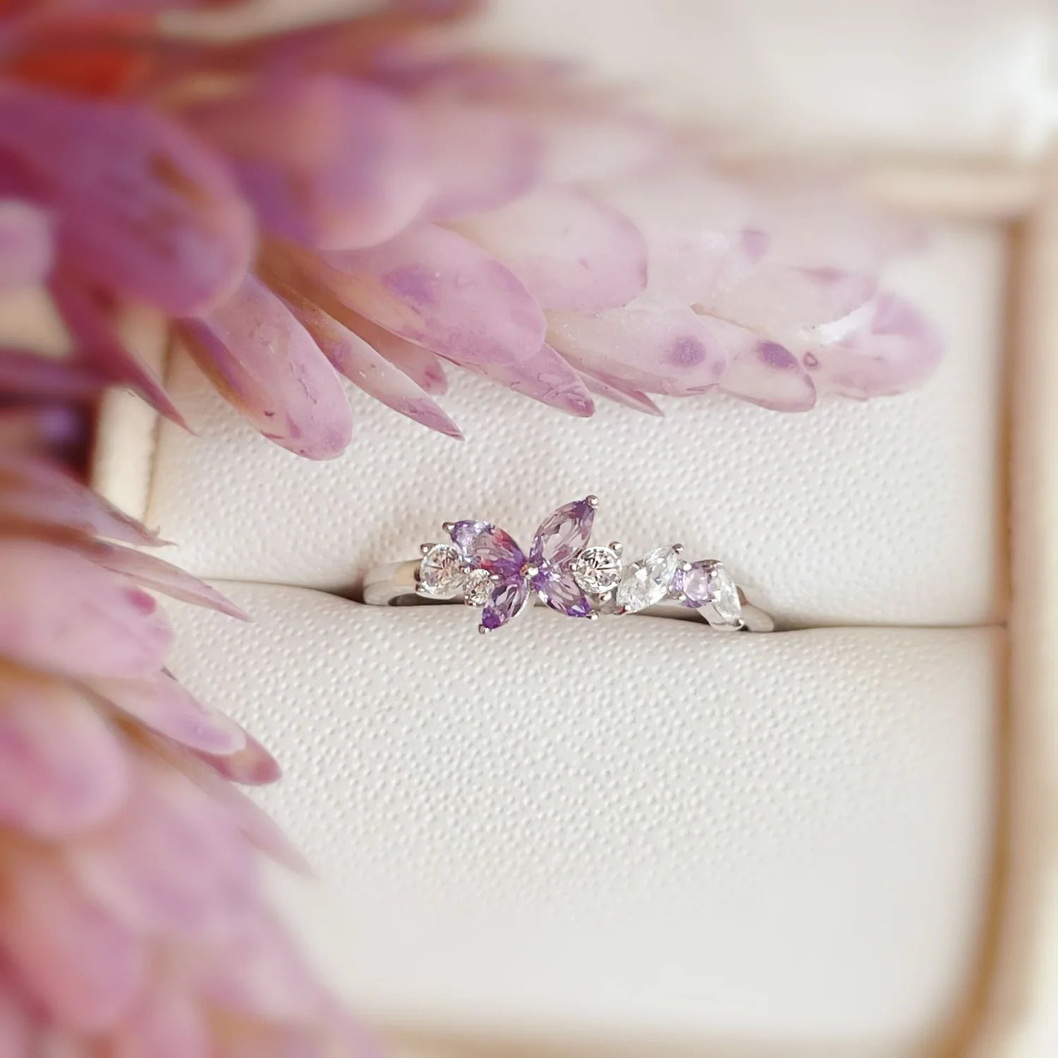 Close-up of the Amethyst Butterfly Ring in 925 sterling silver, showcasing the intricate butterfly design with a central purple amethyst and surrounding clear crystals.