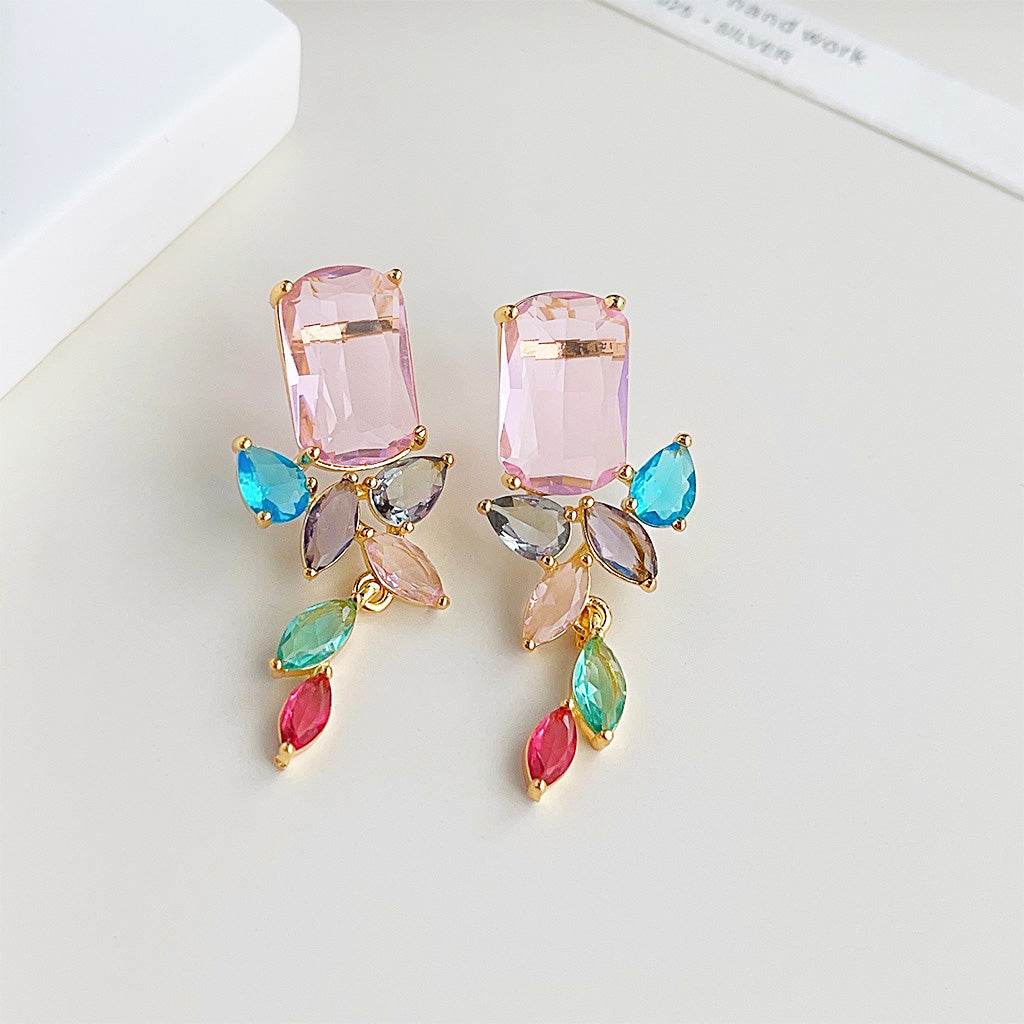 A set of five pairs of gold-plated dangle earrings with a vibrant mix of multi-color zircon gemstones.