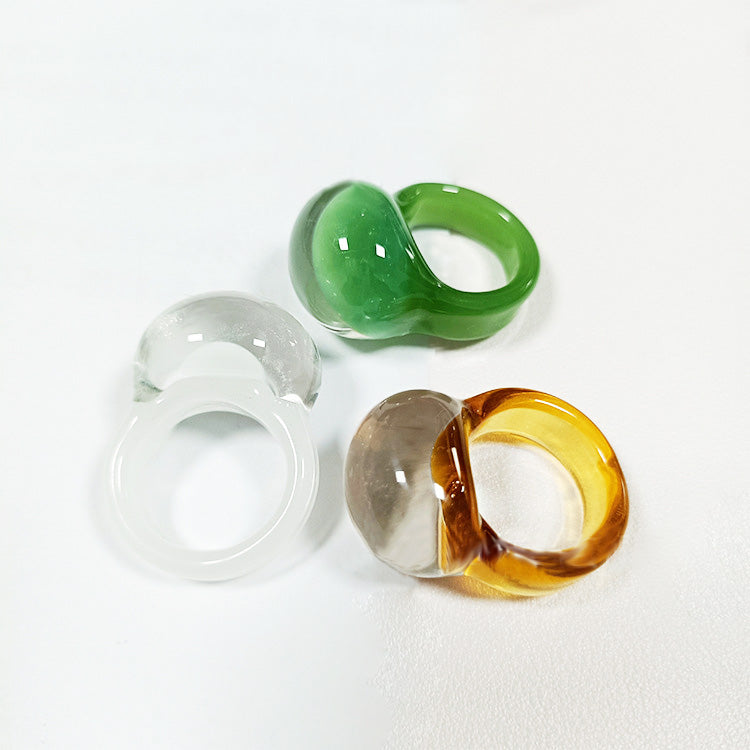 A set of three colorful jelly glaze glass dome rings in green, brown, and white, displayed on a clean white background.