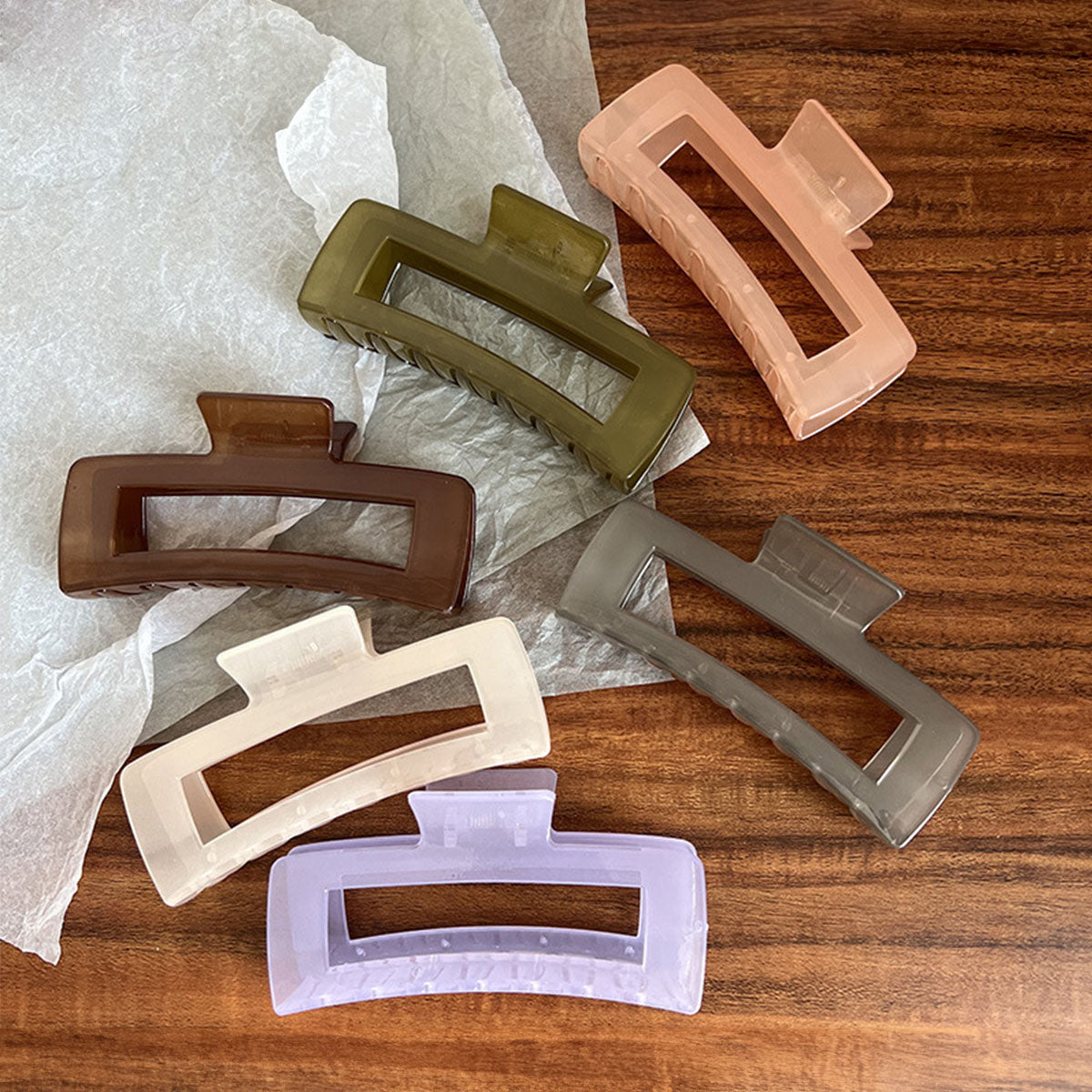 A vibrant set of large rectangle hair clamp claw clips in various pure colors, displayed for sale.
