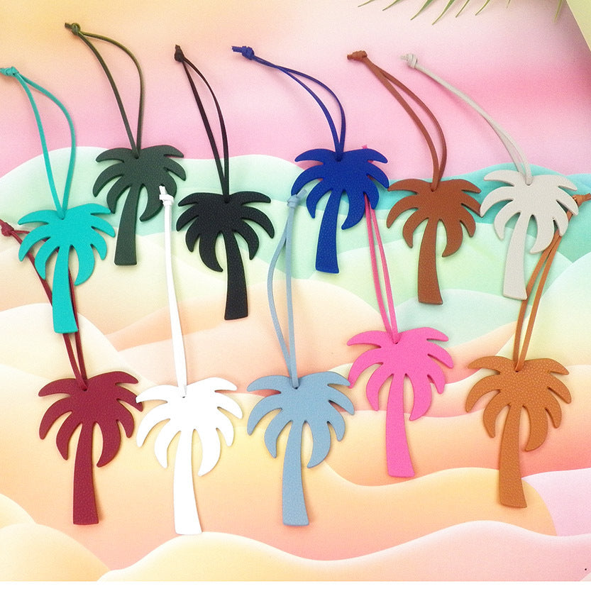 A vibrant collection of Creative Coconut Tree Leather Cord Keychains displayed in various colors, highlighting the playful palm tree design made from PU leather.