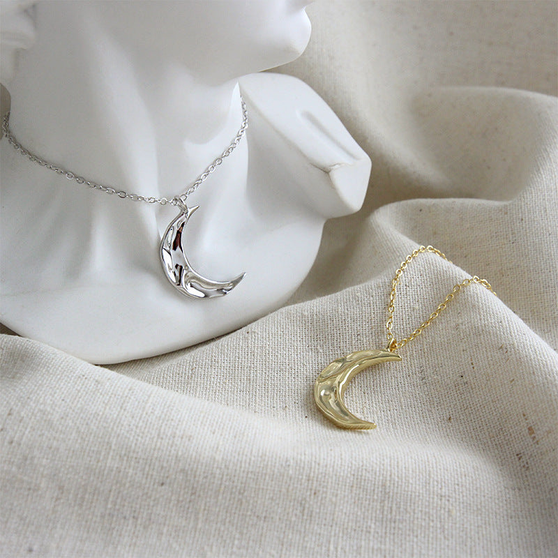 Minimalist 925 sterling silver crescent moon necklaces in both silver and 18K gold plated finishes, displayed for wholesale.