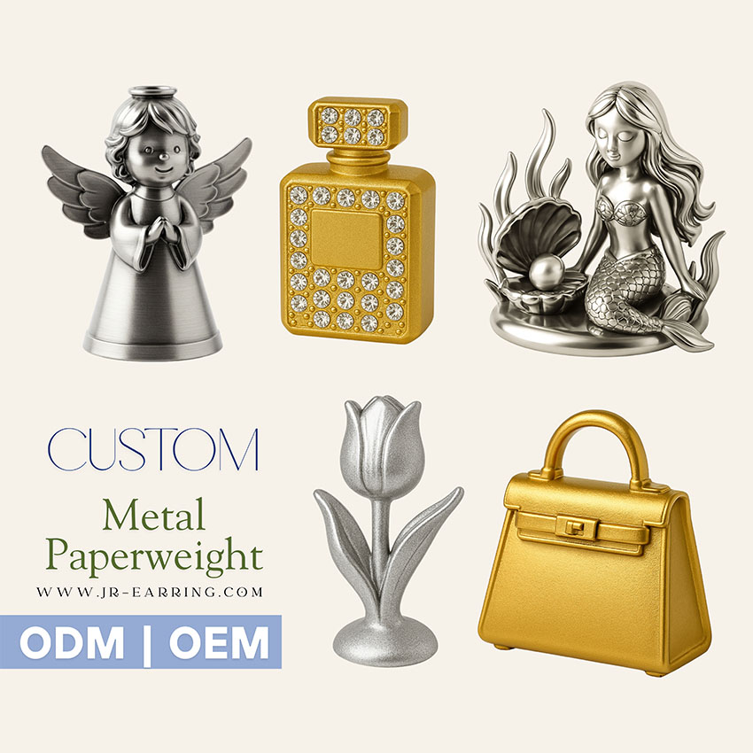 A collection of custom-designed metal paperweights and decorative items by JR Fashion Accessories, showcasing various shapes and finishes for corporate and retail branding.