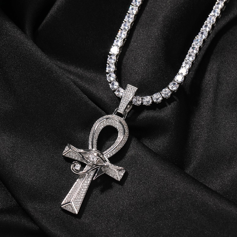 A striking diamond-encrusted Ankh Cross pendant necklace for men, crafted by JR Fashion Accessories, resting on a luxurious black background.