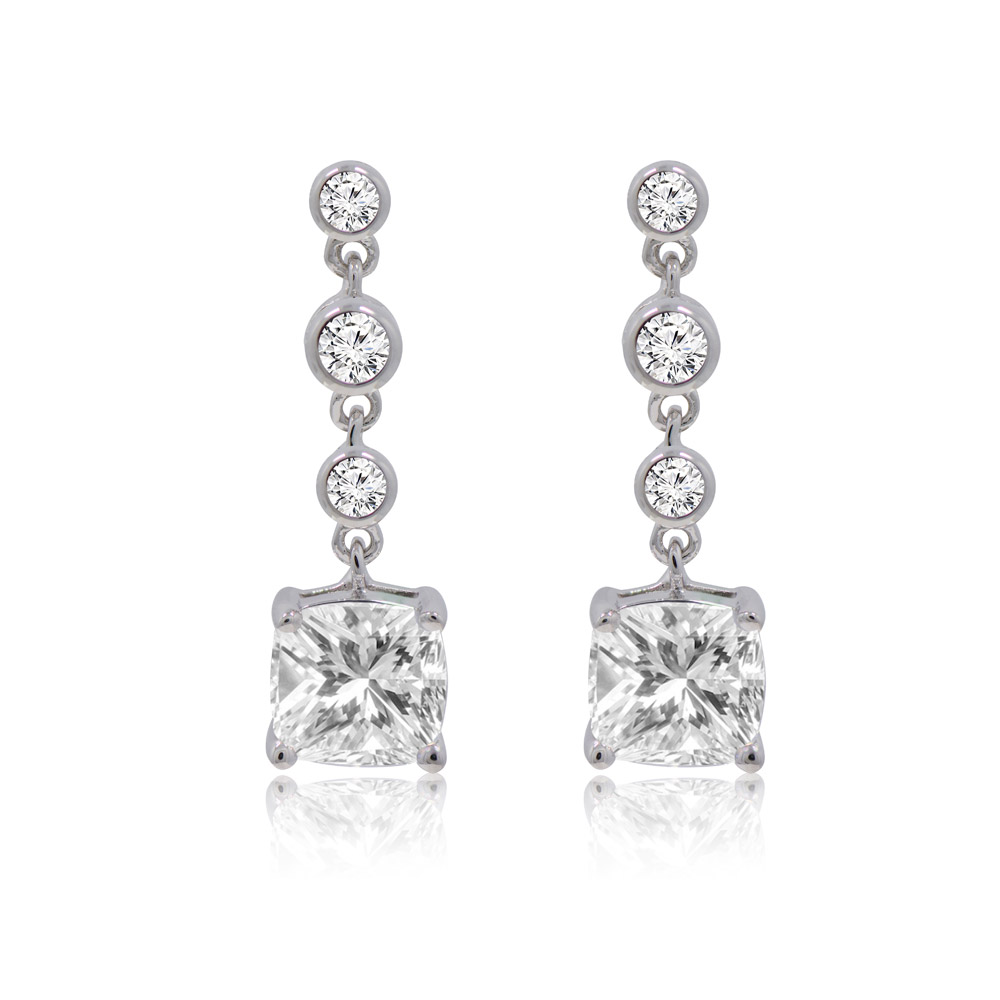 A pair of Swing Cushion Cut Drop Earrings featuring a large square-cut cubic zirconia stone suspended below three smaller round stones, all set in rhodium-plated brass.