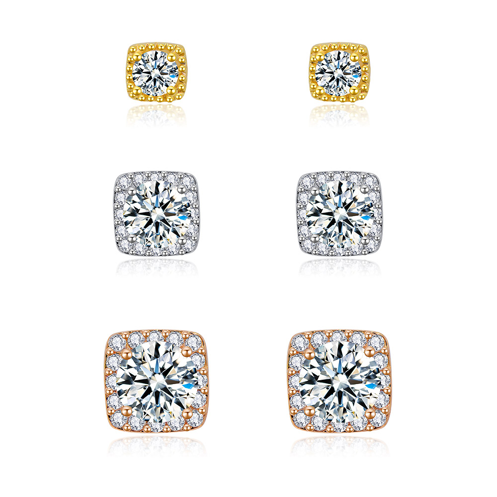 A set of three pairs of square pave stud earrings in gold, silver, and rose gold plated settings, each adorned with sparkling cubic zirconia stones.