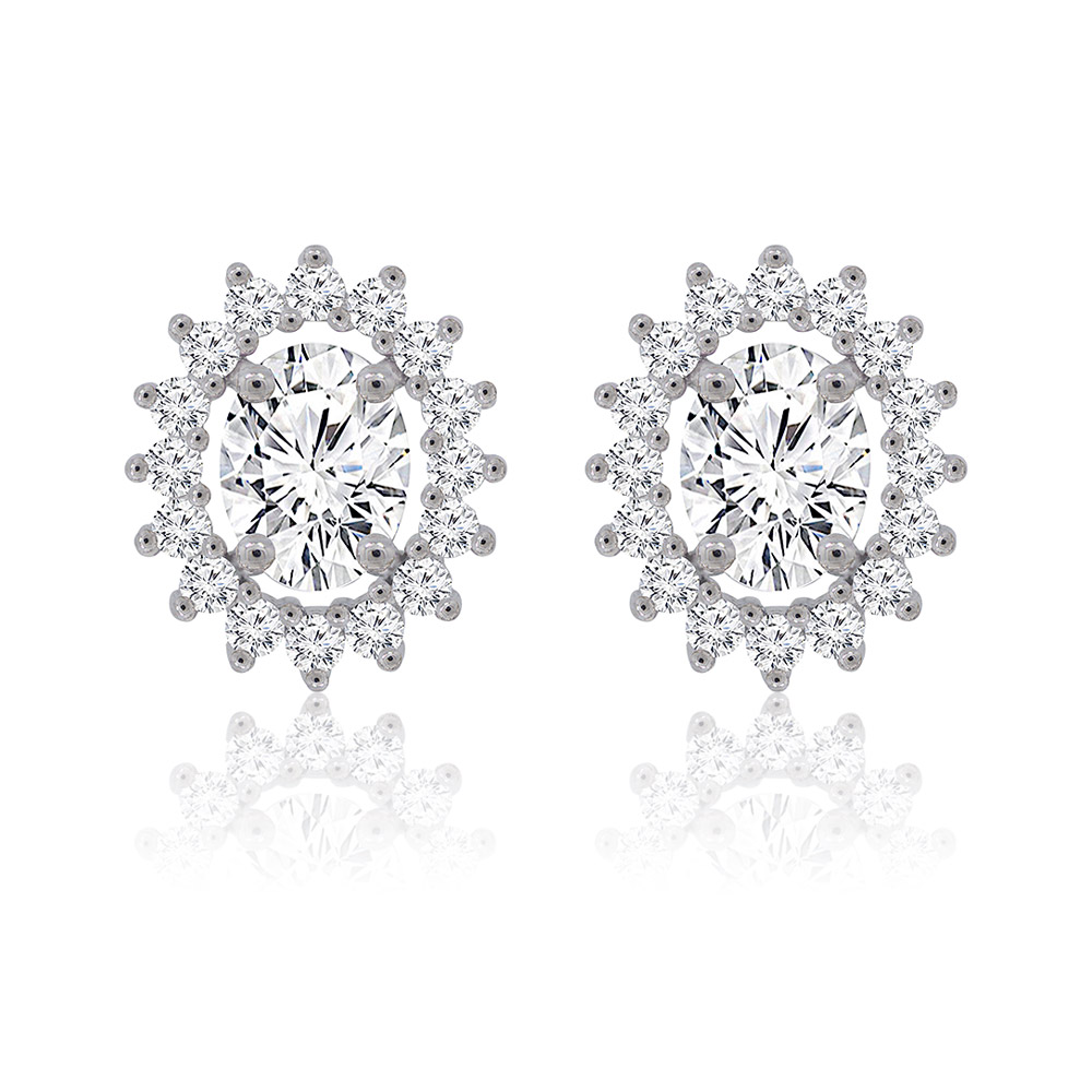 A pair of classic oval halo stud earrings with a central cubic zirconia stone, set in rhodium-plated brass, shown on a clean white background.