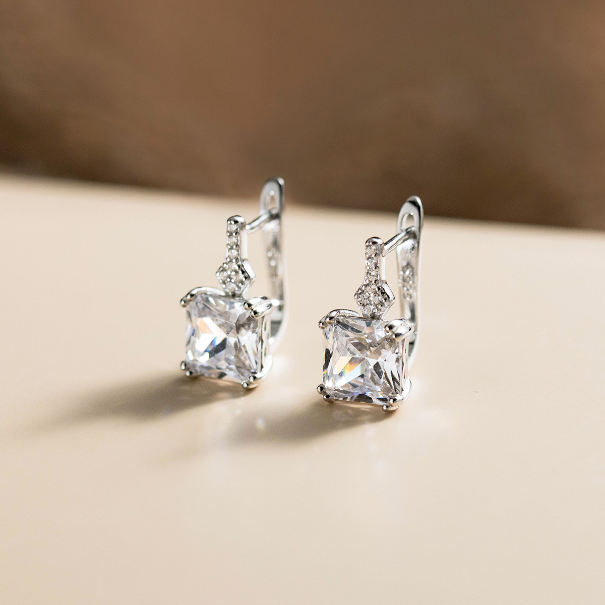 A high-end product shot of a 925 sterling silver CZ stud earring, part of a wholesale gift set.
