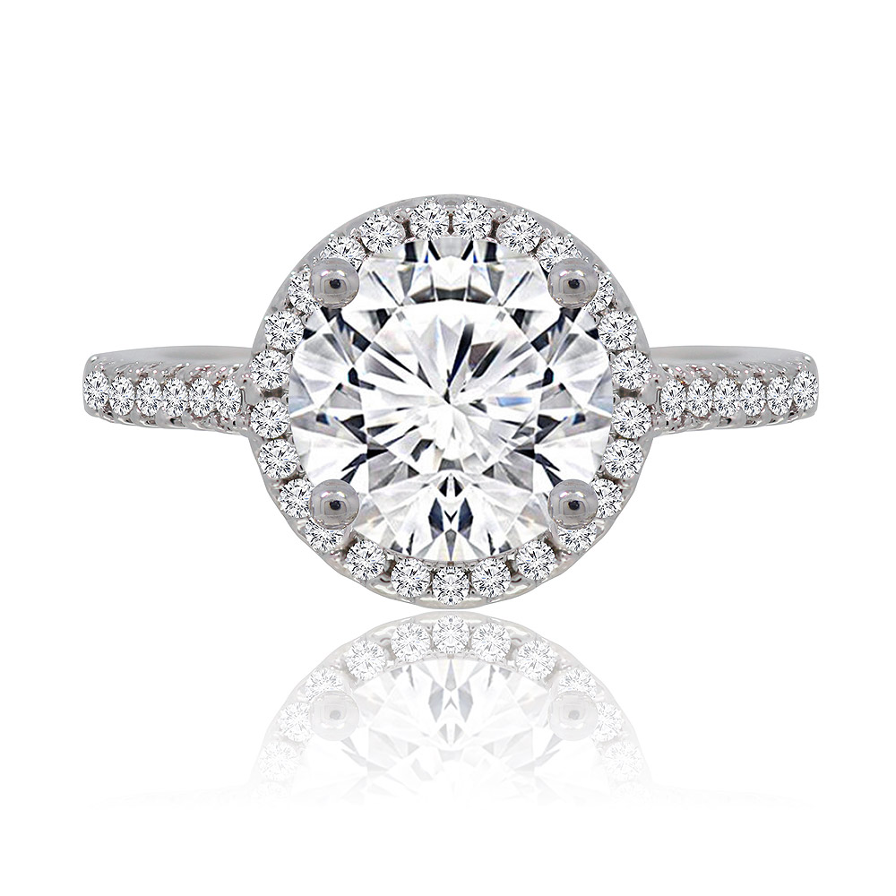 A close-up of the Unique Forever Engaged Ring, showcasing a brilliant 8mm round cubic zirconia center stone surrounded by a sparkling halo, set on a rhodium-plated brass band.