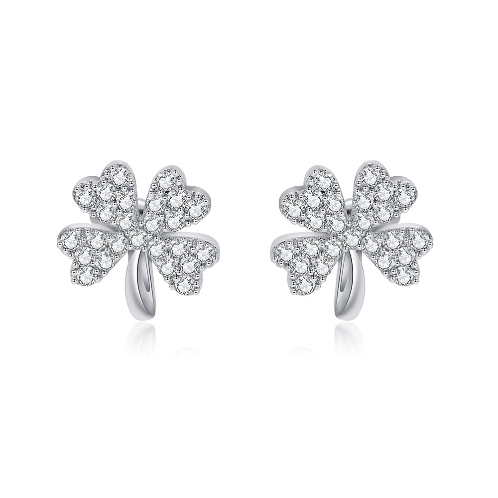 A pair of silver Lucky Leaf Clover clip-on earrings, studded with sparkling cubic zirconia stones, on a white background.