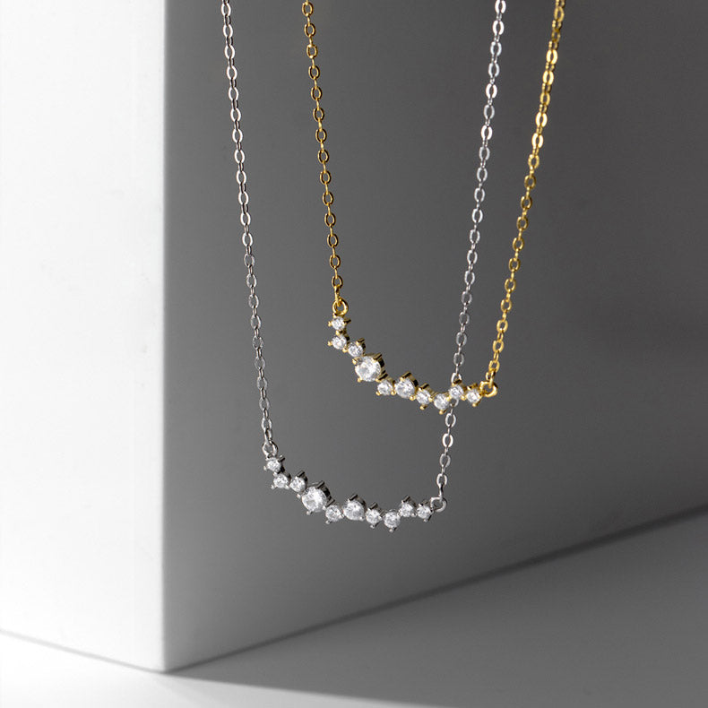 A set of 925 sterling silver smile choker necklaces with cubic zirconia, shown in both gold and silver finishes on a neutral background.