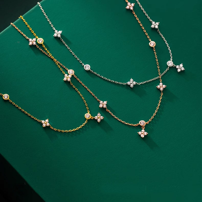 A stunning collection of 925 sterling silver four-leaf clover necklaces, showcasing both gold and silver options against a clean background.