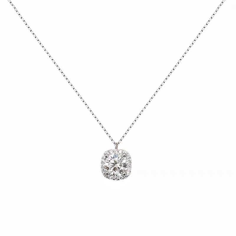 A close-up of the 925 Sterling Silver CZ Halo Pendant Necklace, showcasing the brilliant central cubic zirconia surrounded by smaller stones.