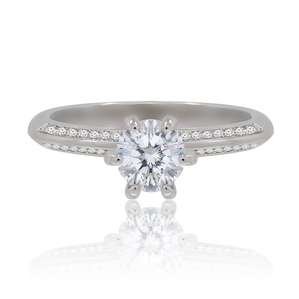 Close-up of the Romantic Love Eternity Ring, showcasing a central round cubic zirconia stone with smaller stones encrusted along the rhodium-plated brass band.