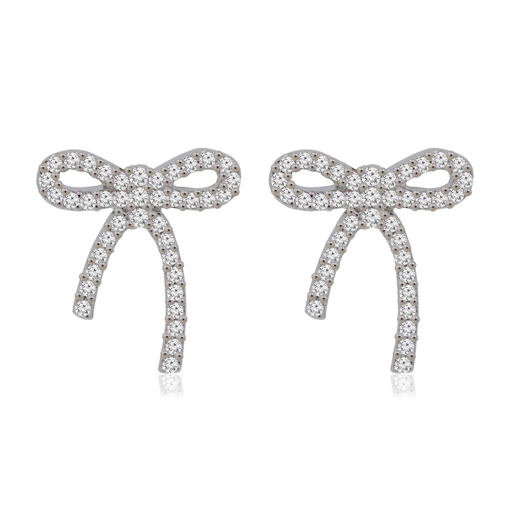 A detailed close-up of the Sweet Bow Tie Stud Earrings, showcasing the intricate bow design and sparkling cubic zirconia stones on a rhodium-plated brass base.