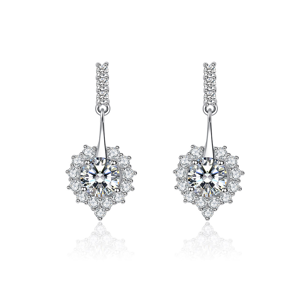 A close-up of the Dangle Sweetheart Stud Earring, showcasing its elegant teardrop design with a large central cubic zirconia stone surrounded by a halo of smaller sparkling gems, all set in rhodium-plated brass.