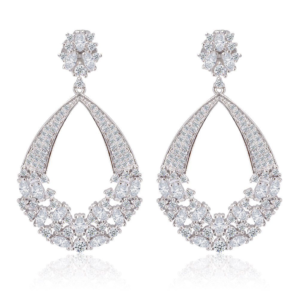 Elegant teardrop chandelier earrings in rhodium-plated brass with a floral pattern of brilliant white cubic zirconia stones.