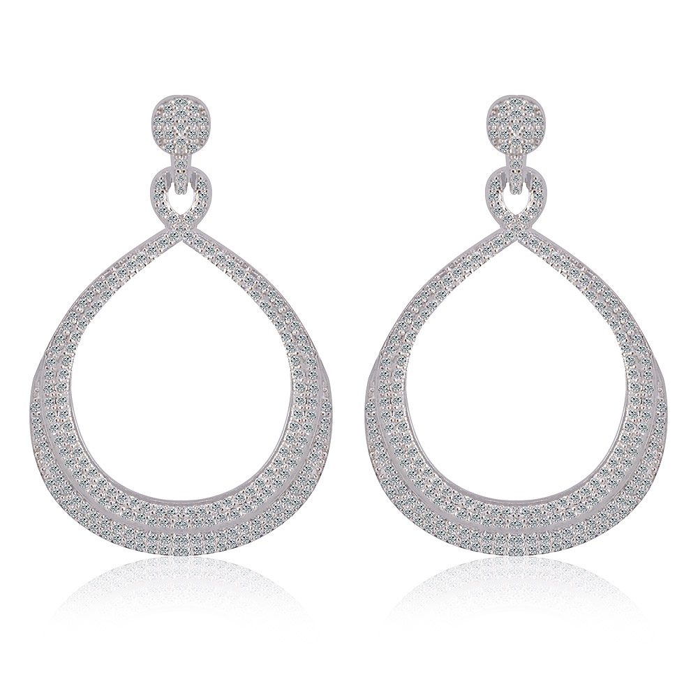 A stunning pair of Glam On Earrings, featuring teardrop-shaped silver encrusted with sparkling cubic zirconia, perfect for bridal or formal wear.