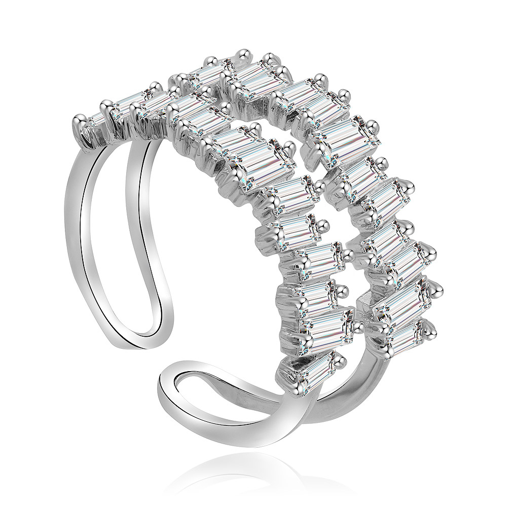 A detailed view of the Uneven Baguette Cut Morganite Ring, highlighting its rhodium-plated brass band and two bars of prong-set, baguette-cut cubic zirconia.