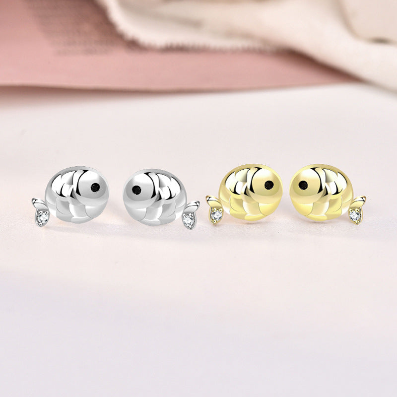 A pair of 925 sterling silver and a pair of gold-plated carp fish stud earrings, each adorned with a sparkling cubic zirconia stone.