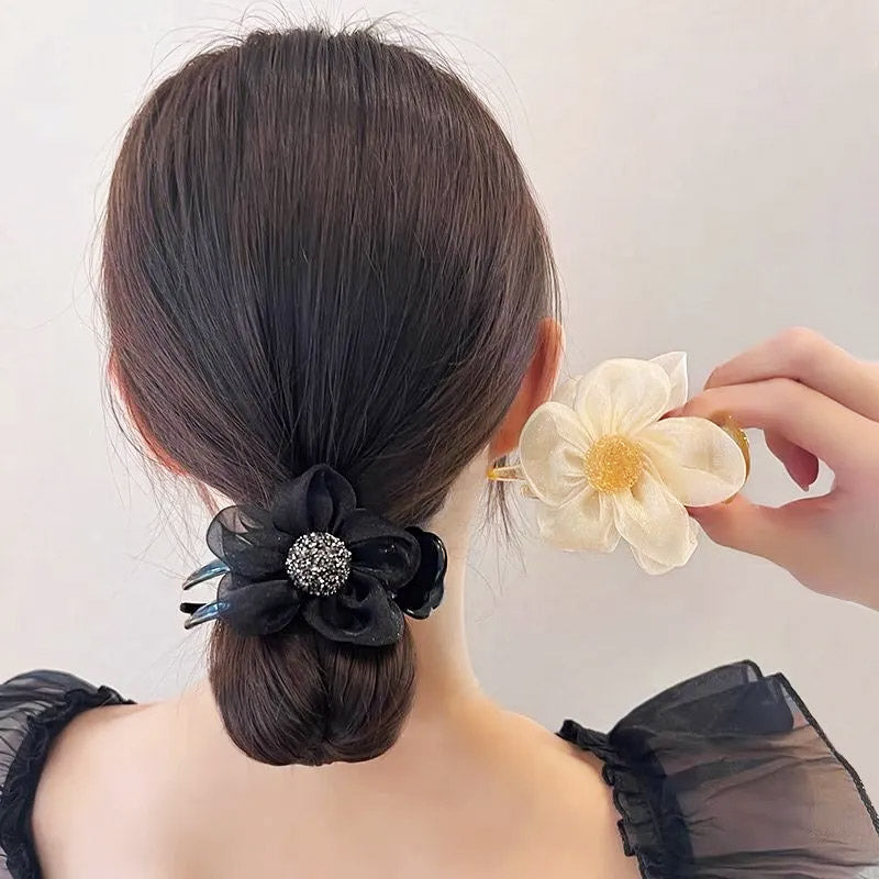 Product showcase of lace mesh flower duck-billed hair clips in beige and black.