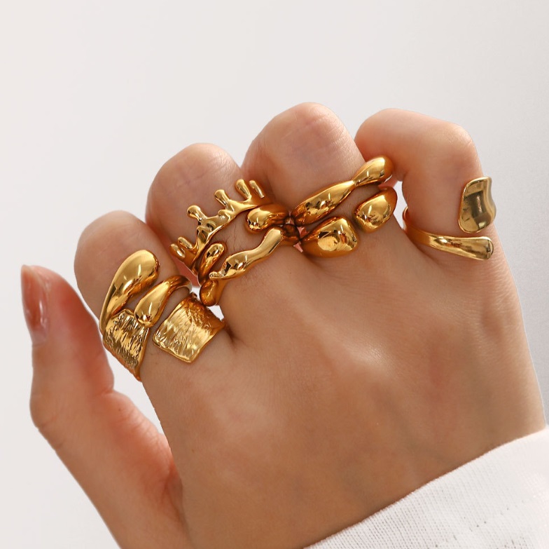A model's hand showcasing the elegant gold-plated Stainless Steel Chunky Ring, highlighting its bold design and lustrous finish.