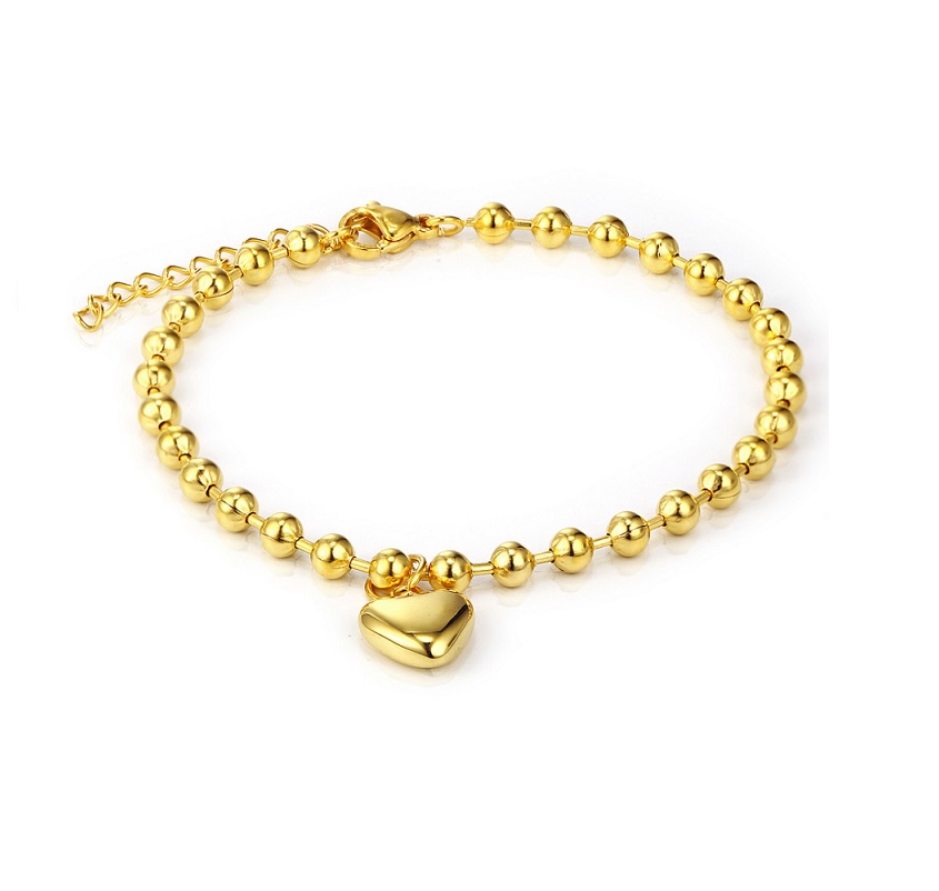 A close-up of the elegant Heart Charm Beaded Bracelet in a polished gold finish, showcasing the delicate beads and central heart charm.