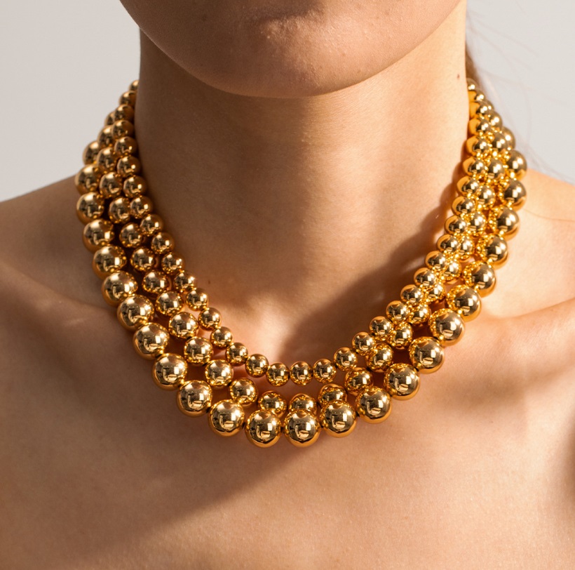 Close-up of the Stainless Steel Gold Plated Bead Necklace (JRS-016), showcasing the detailed gold beads and high-quality finish.