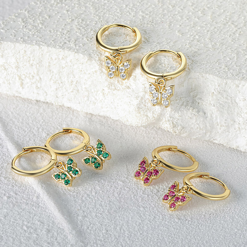 A stunning set of 925 sterling silver butterfly drop earrings with clear, green, and pink zircon gemstones, displayed on a white background.