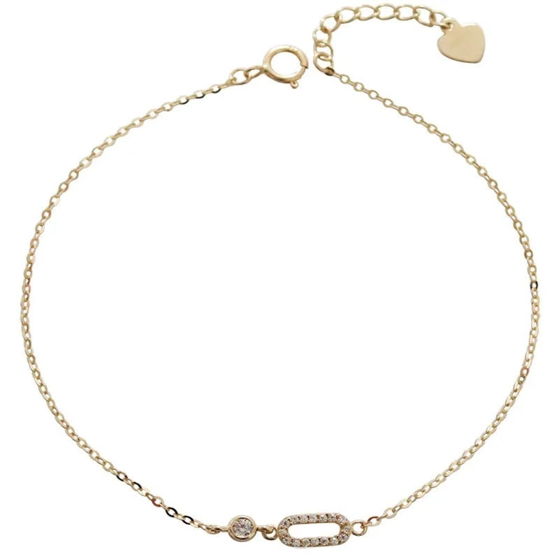A set of five 14K gold-plated 925 sterling silver bracelets featuring geometric designs with baguette-cut cubic zirconia stones, displayed on a clean white background.