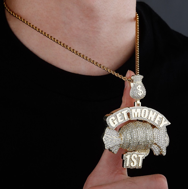 Custom 18K gold hip hop pendant with a 'GET MONEY' design, featuring a diamond-encrusted money bag and fist, hanging from a thick gold chain.