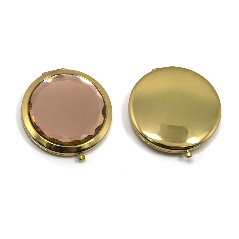 A pair of round, gold-plated crystal gemstone cosmetic mirrors, one showing the decorative gemstone top and the other showing the plain gold back.