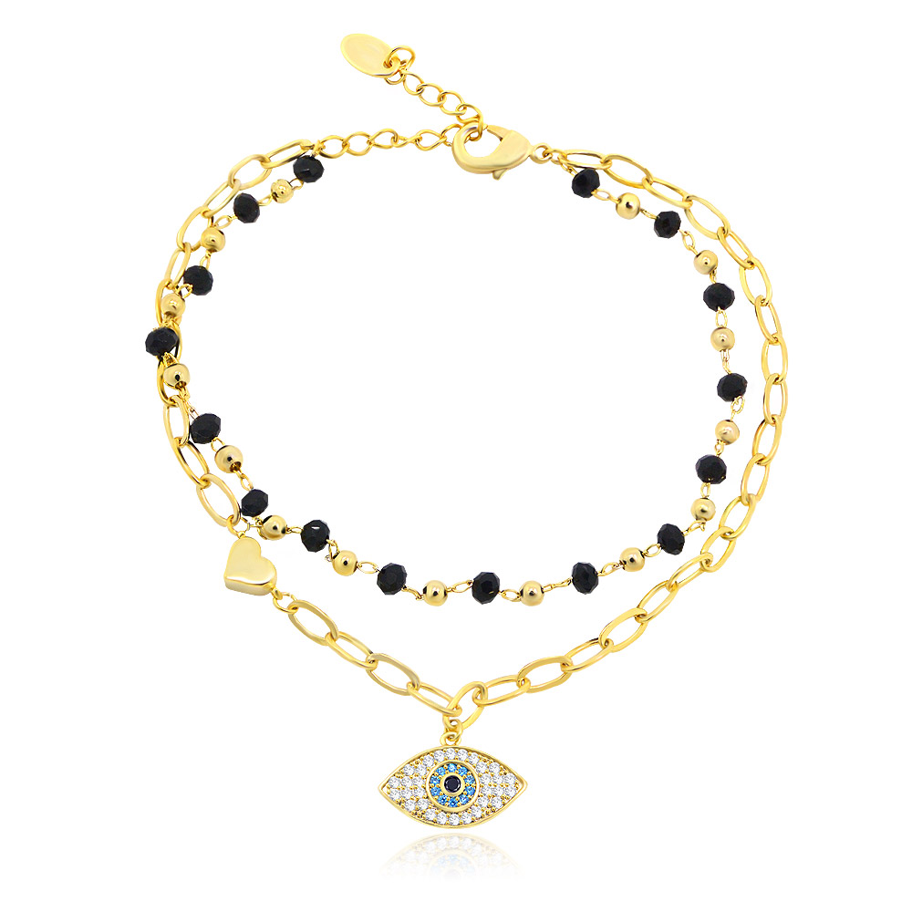 Close-up of the Seed Beads Evil Eye Bracelet, showing the detailed 18k gold chain, central eye charm with cubic zirconia, and black bead accents.