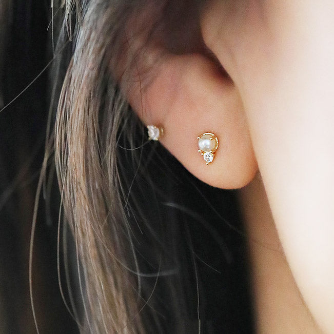 A complete set of five wholesale 925 sterling silver stud earrings, featuring mini cubic zirconia and elegant pearl designs.