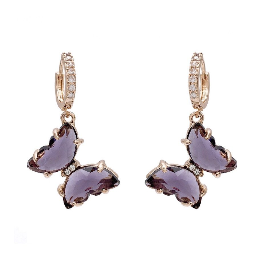 Close-up of the Purple Butterfly Huggie Earrings (JRE-113), showcasing the detailed gold-plated brass, sparkling purple crystal, and white cubic zirconia accents.